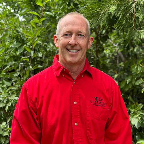 Dr. Ryan Brock in front of a tree